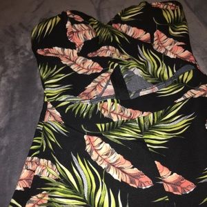 Cute Romper with an opening in the stomach area.